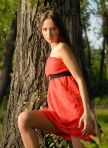 Amazing baby in red hot dress is on the lake shore flashing her erected nipples