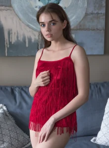 Nude busty beauty in tiny red dress