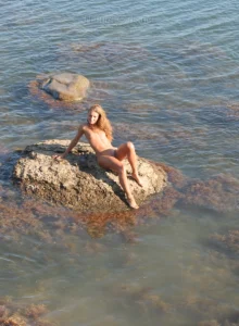 Teen nudist on the big stone